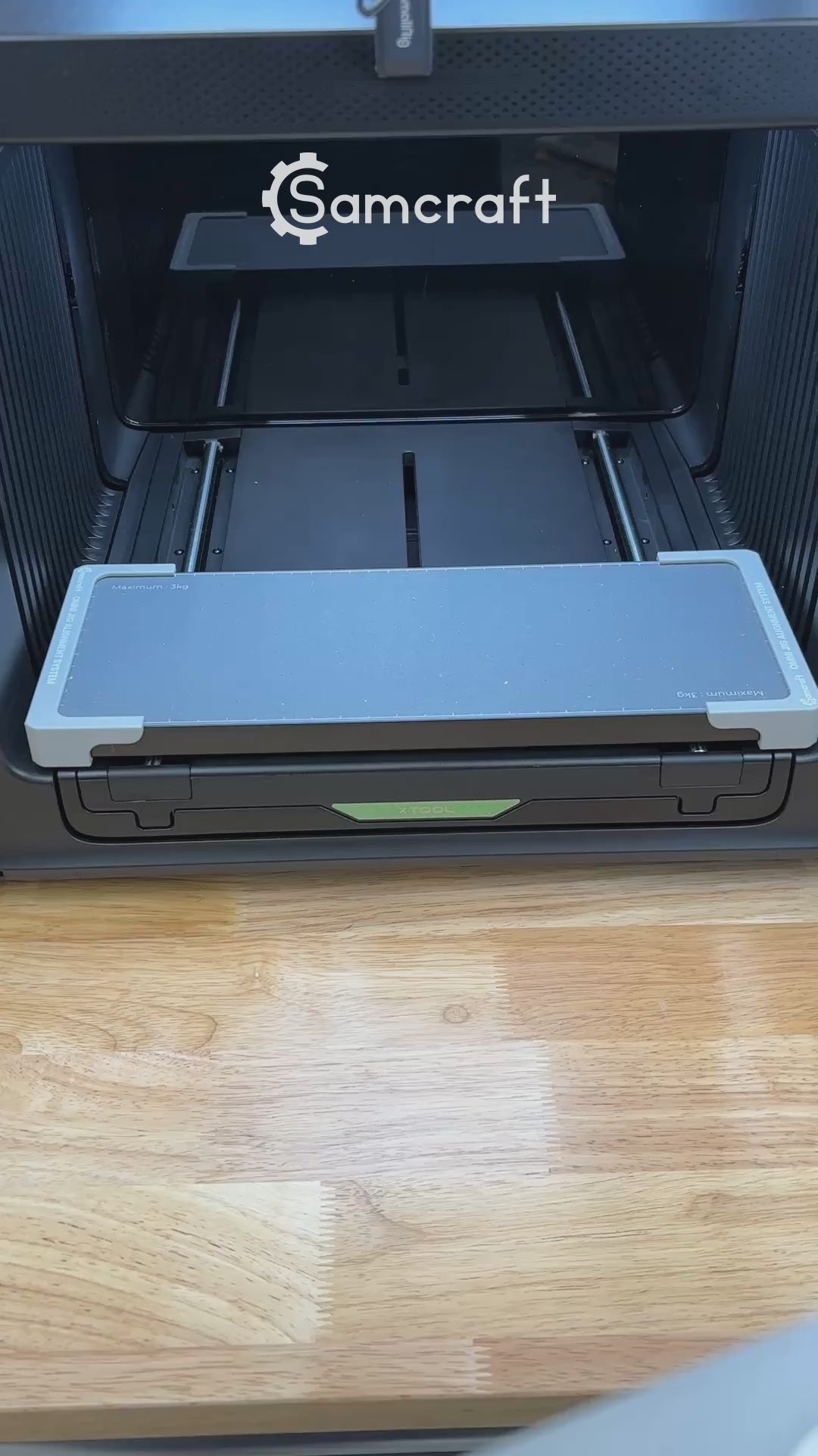 Video of the Samcraft round patch jig for the xTool Omni UV printer being loaded with leatherette patches and placed on the printer bed.
