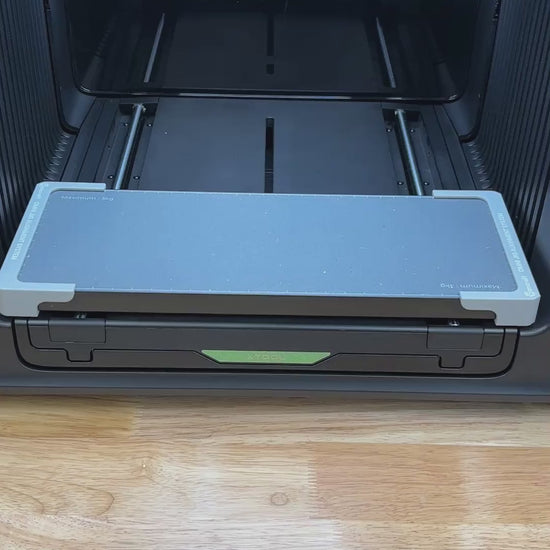 Video of the Samcraft carpenter pencil jig for the xTool Omni UV printer, loaded with carpenter pencils and placed on the printer bed.