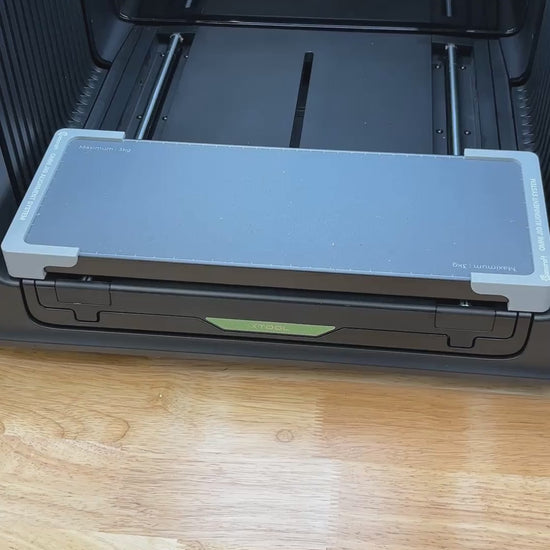 Video of the Samcraft round pet tag jig for the xTool Omni UV printer being loaded with aluminum round tags and placed on the printer bed.