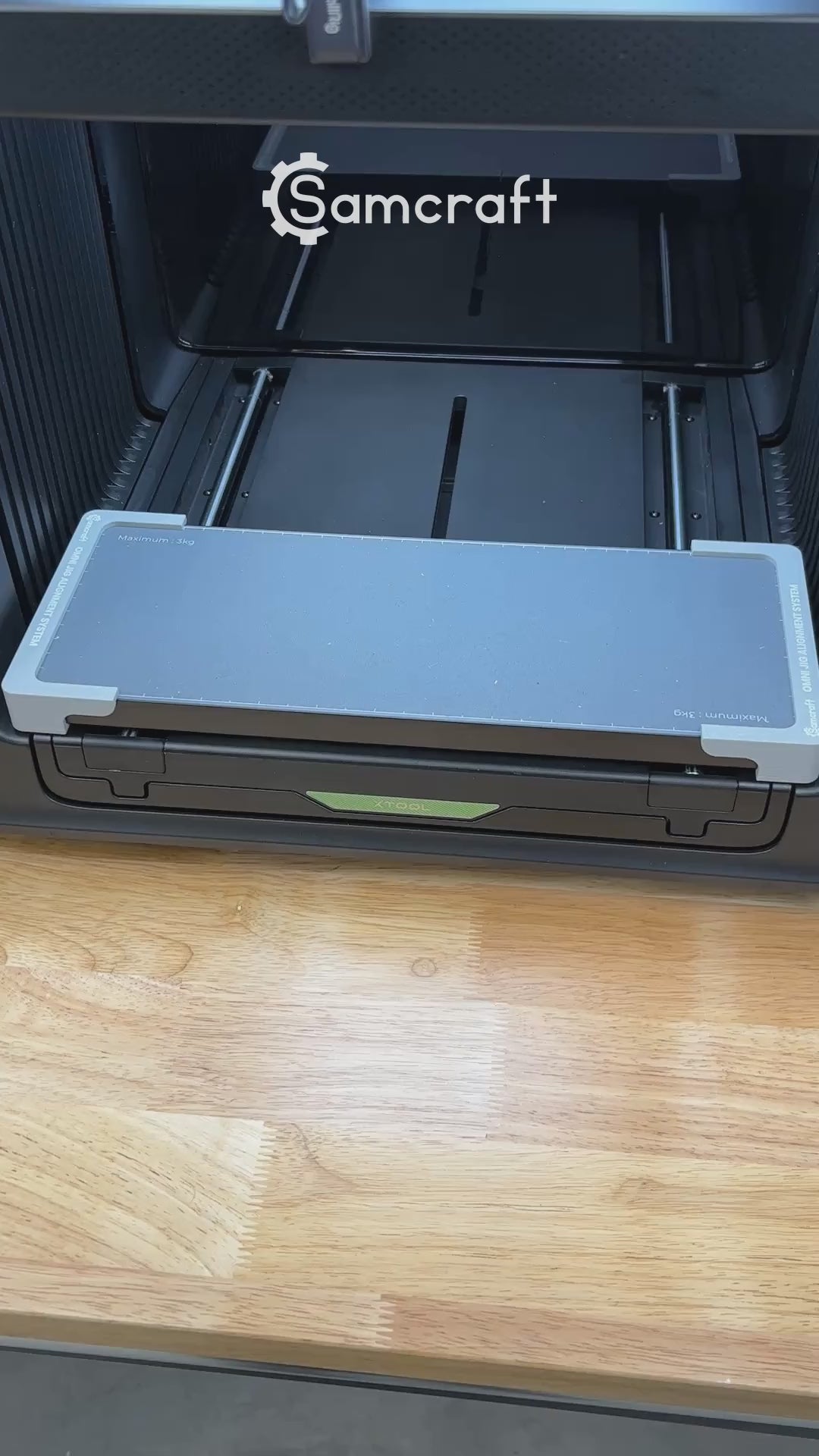 Video of the Samcraft round pet tag jig for the xTool Omni UV printer being loaded with aluminum round tags and placed on the printer bed.