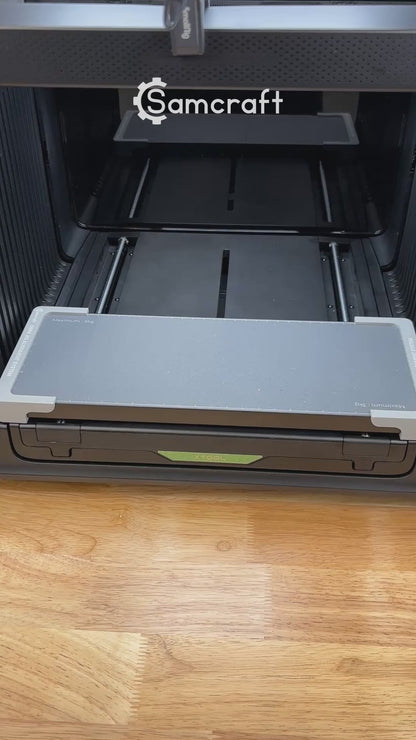 Video of the Samcraft oval patch jig for the xTool Omni UV printer being loaded with leatherette patches and placed on the printer bed.