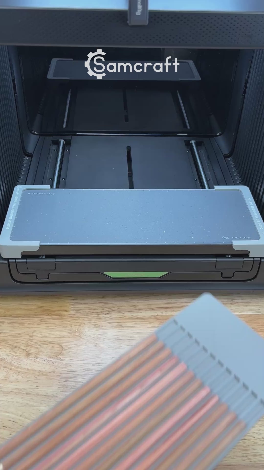 Video of the Samcraft hexagon pencil jig for the xTool Omni UV printer being loaded with pencils and placed on the printer bed.