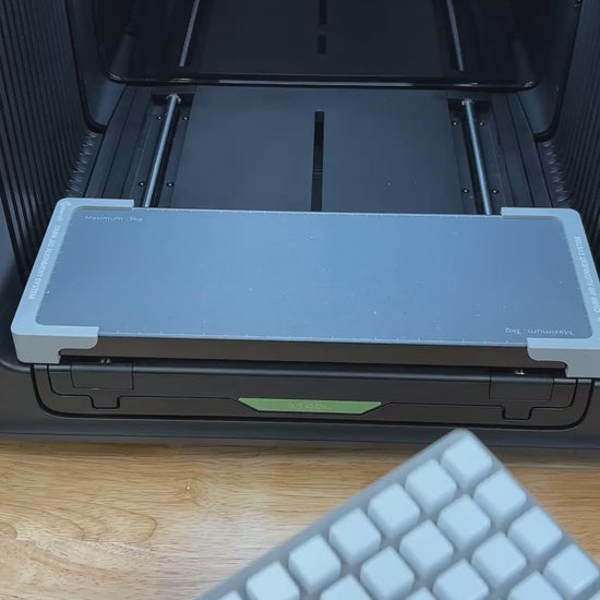 Video of the Samcraft 16mm dice jig for the xTool Omni UV printer being loaded with blank dice and placed on the printer bed.