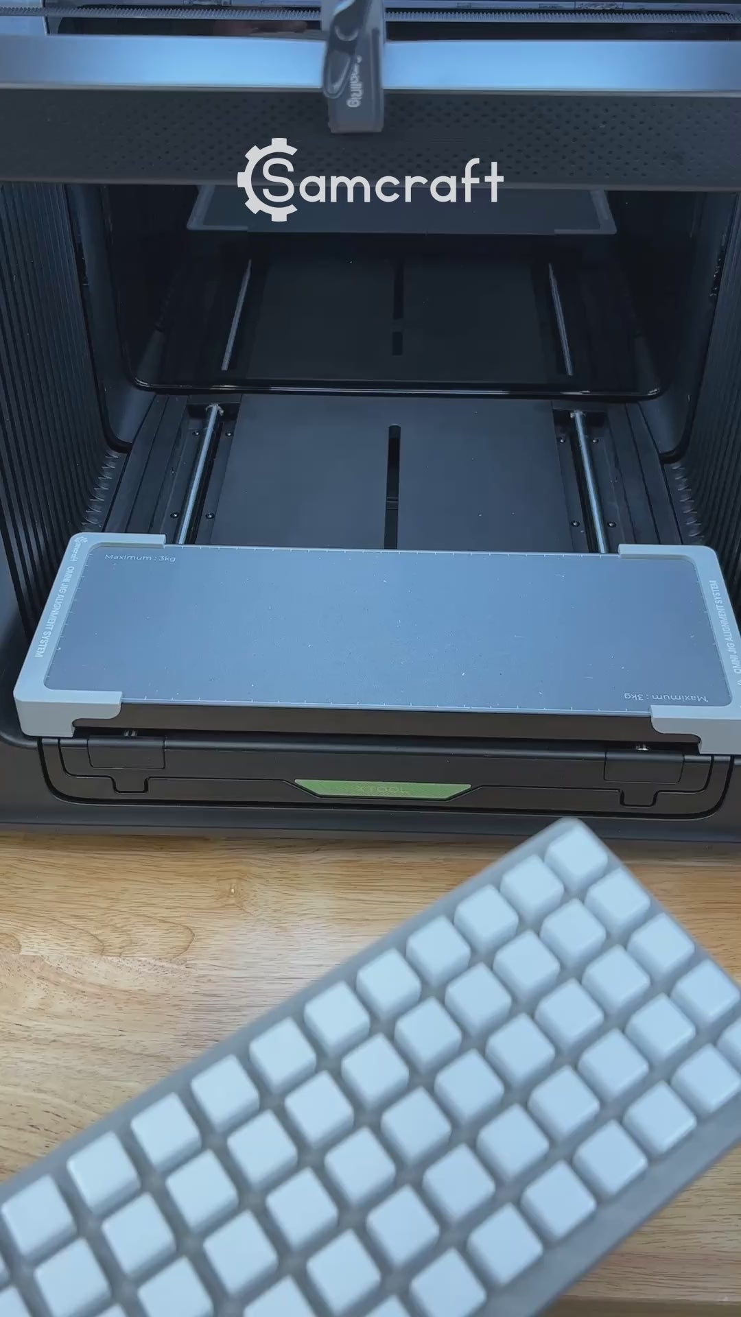 Video of the Samcraft 16mm dice jig for the xTool Omni UV printer being loaded with blank dice and placed on the printer bed.