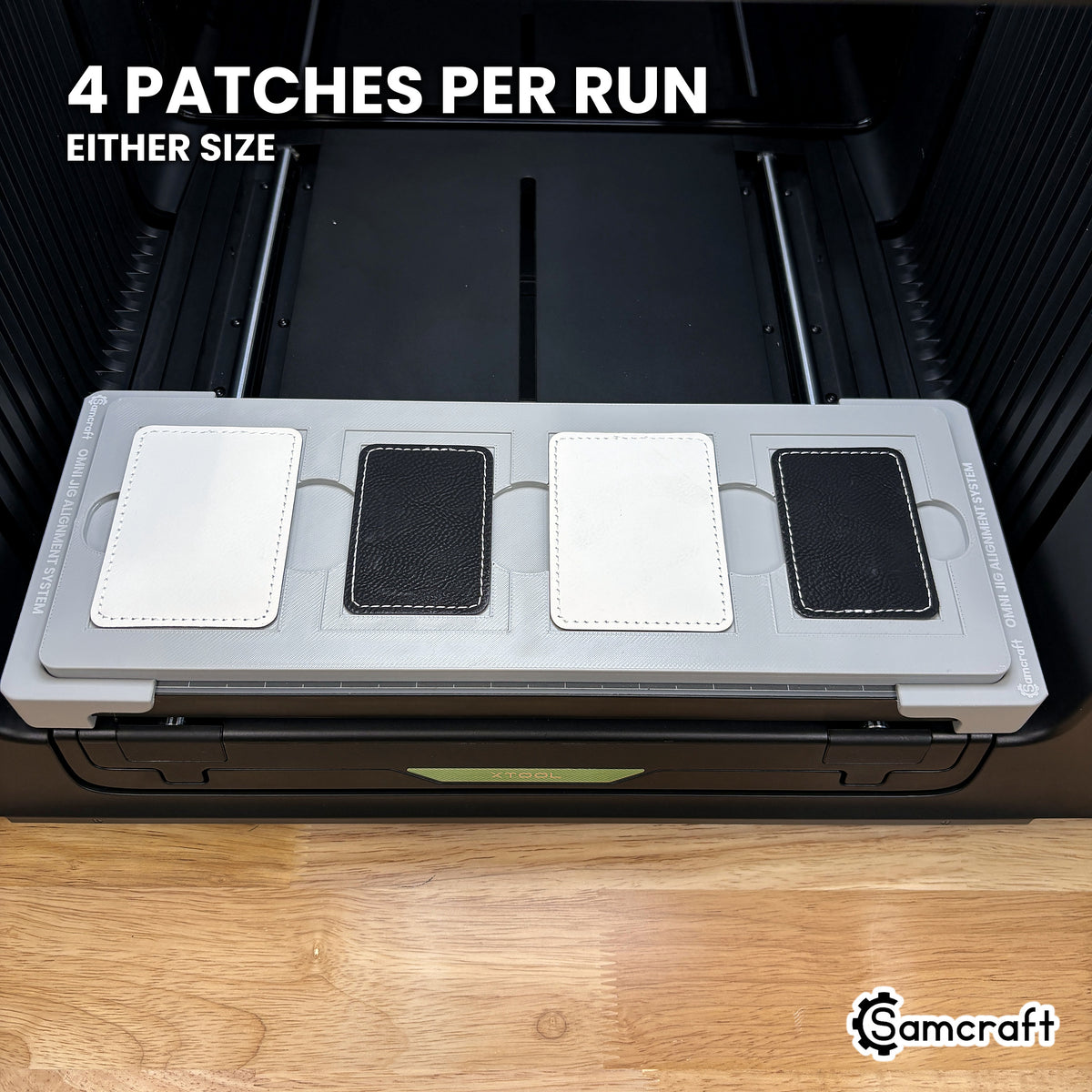 Samcraft rectangle patch jig for the xTool Omni loaded with four rectangular leatherette patches, a full set printed in one job.