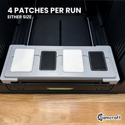 Samcraft rectangle patch jig for the xTool Omni loaded with four rectangular leatherette patches, a full set printed in one job.