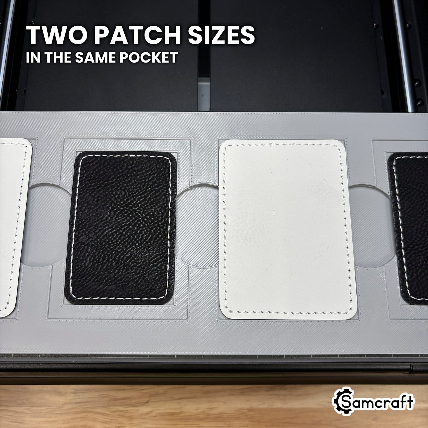 Two sizes of rectangular leatherette patch shown side by side in the Samcraft xTool Omni jig, both seated from the same nested pocket.