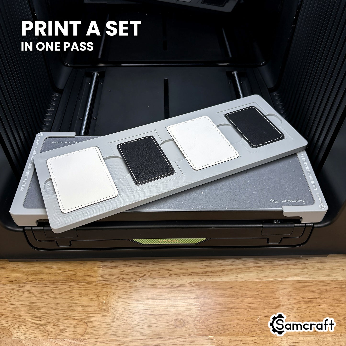Four printed rectangular leatherette patches in the Samcraft xTool Omni jig, a matching set finished in a single job.