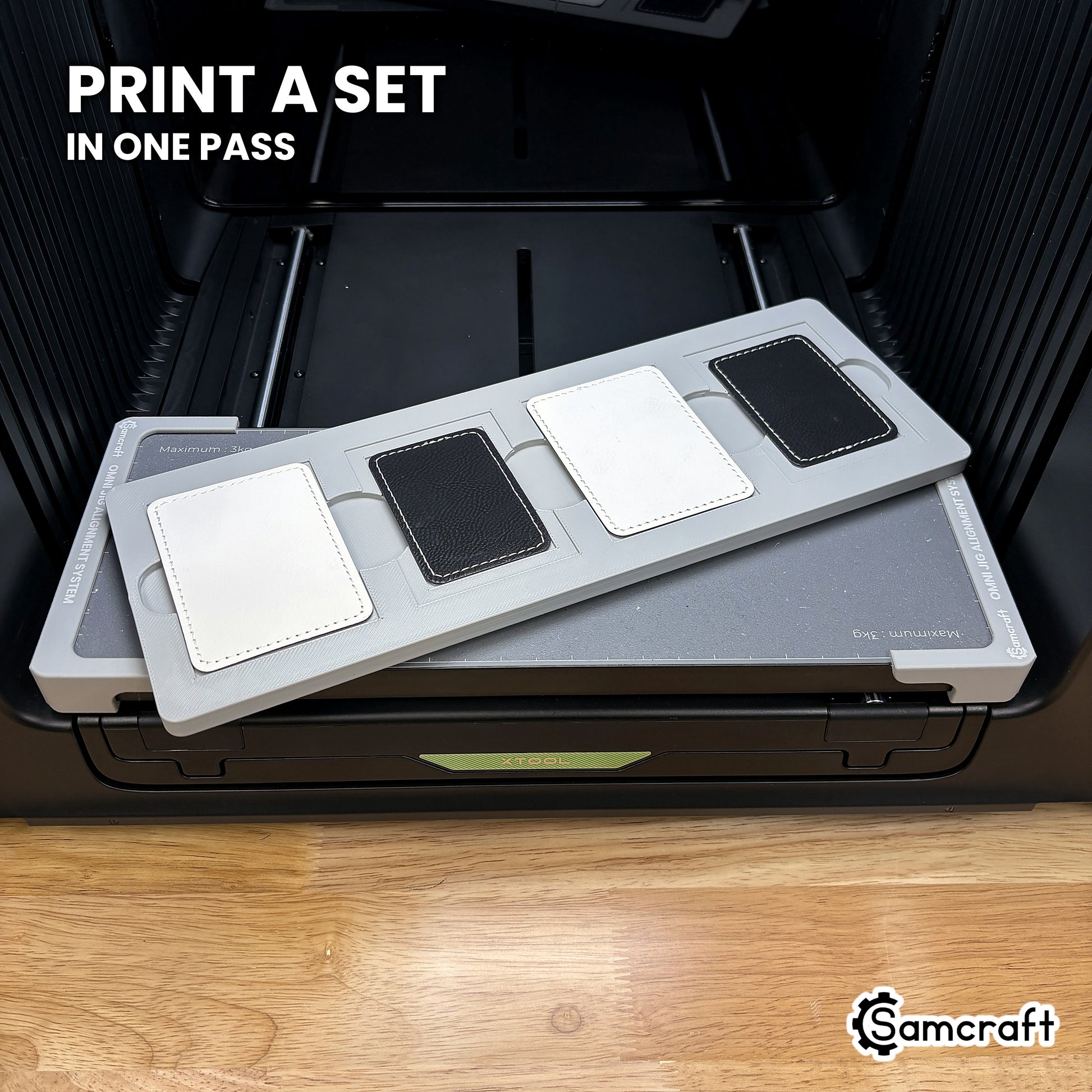 Four printed rectangular leatherette patches in the Samcraft xTool Omni jig, a matching set finished in a single job.