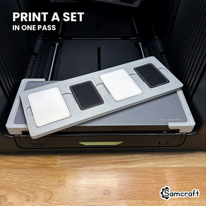 Four printed rectangular leatherette patches in the Samcraft xTool Omni jig, a matching set finished in a single job.
