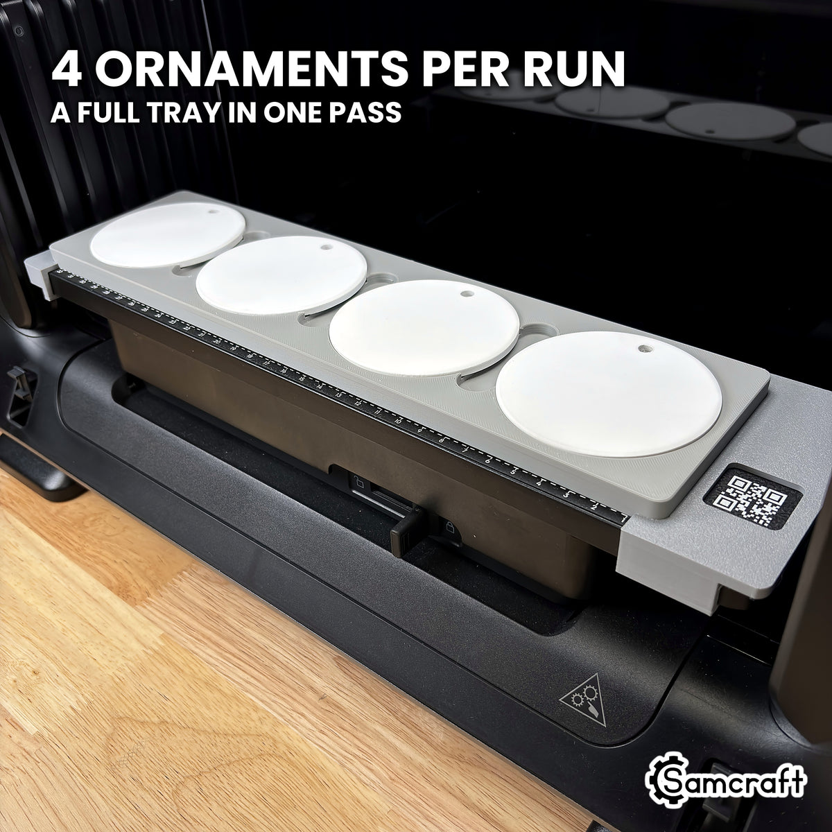 Samcraft round ceramic ornament jig for the eufyMake E1 loaded with four white ceramic ornaments, a full run in a single pass.