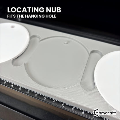 Close-up of an empty pocket in the Samcraft round ceramic ornament jig for the eufyMake E1, showing the locating nub that fits the ornament's hanging hole.