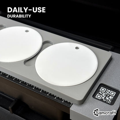 Close-up of white ceramic ornaments in the Samcraft round ceramic ornament jig on the eufyMake E1 bed, built for daily-use durability.