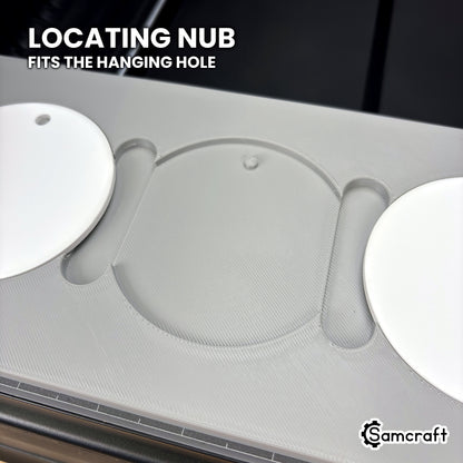 Close-up of an empty pocket in the Samcraft round ceramic ornament jig for the xTool Omni, showing the small locating nub that fits the ornament's hanging hole.