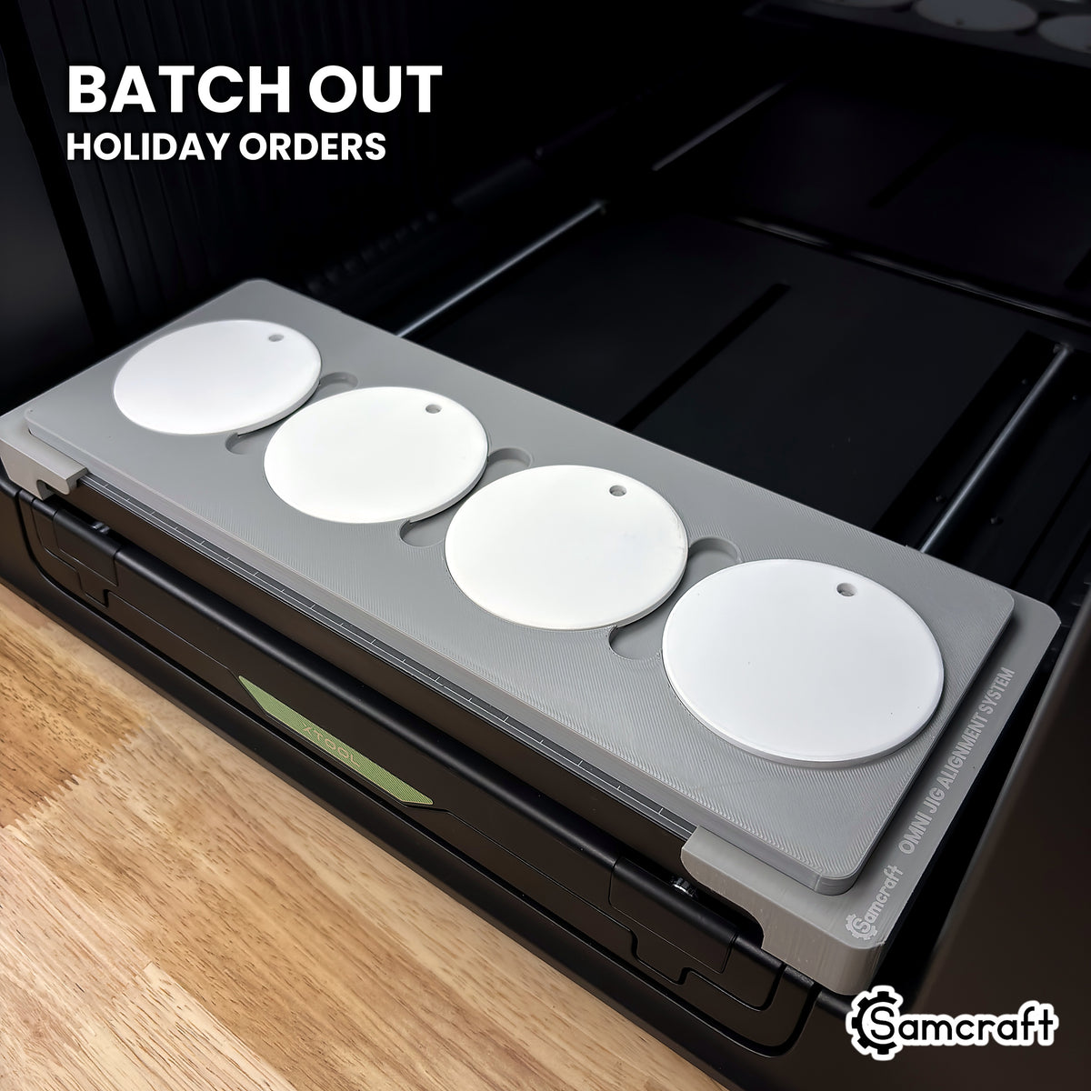 Samcraft xTool Omni round ceramic ornament jig filled with four white ceramic ornaments, ready for holiday ornament batch orders.