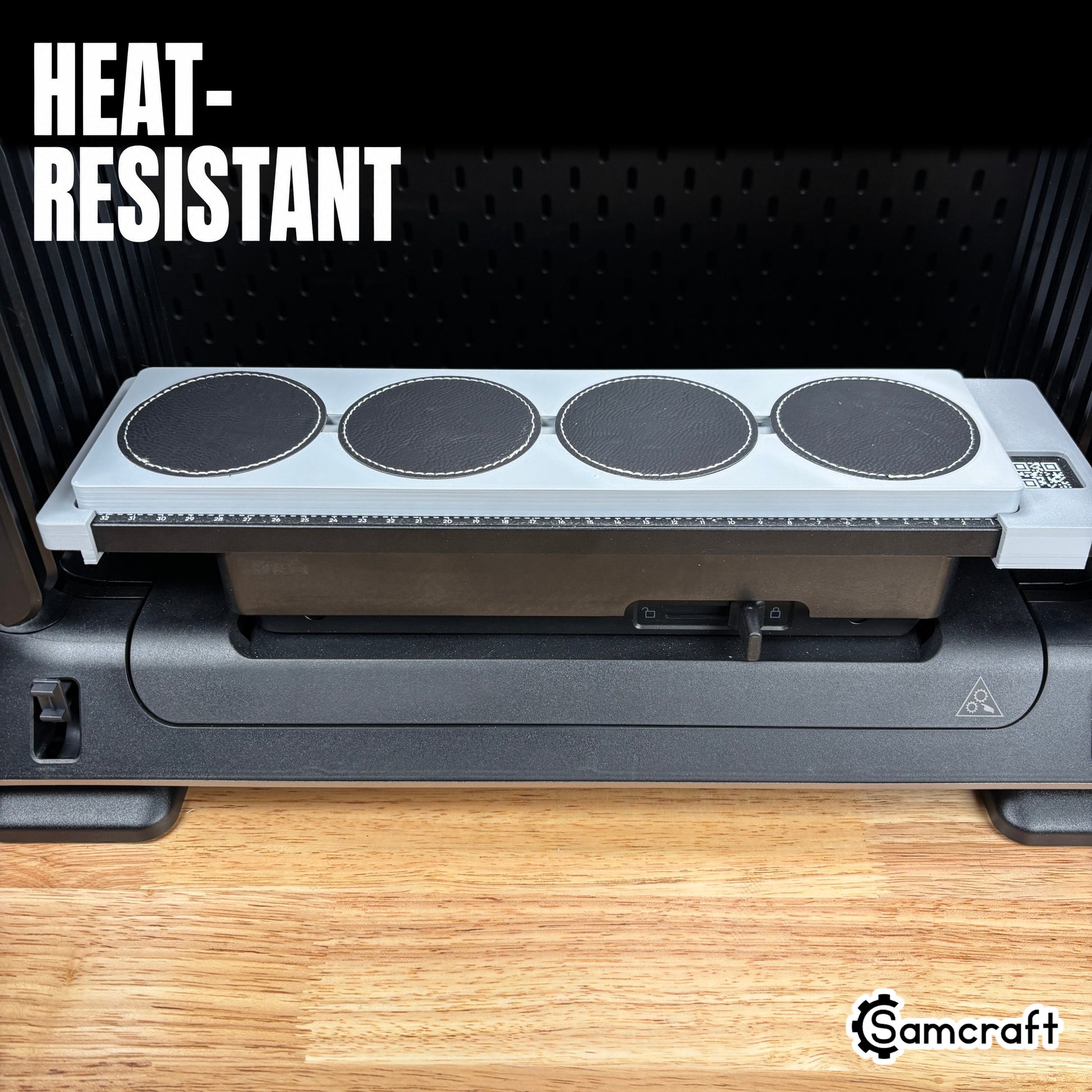 Round Patch Jig for the eufyMake E1 — close-up of the gray 3D-printed tray showing the empty circular patch pockets with the built-in alignment ruler, highlighting the heat-resistant material.