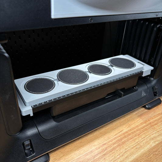 Samcraft round patch jig on the eufyMake E1 print bed, holding four round black patches in circular recesses.
