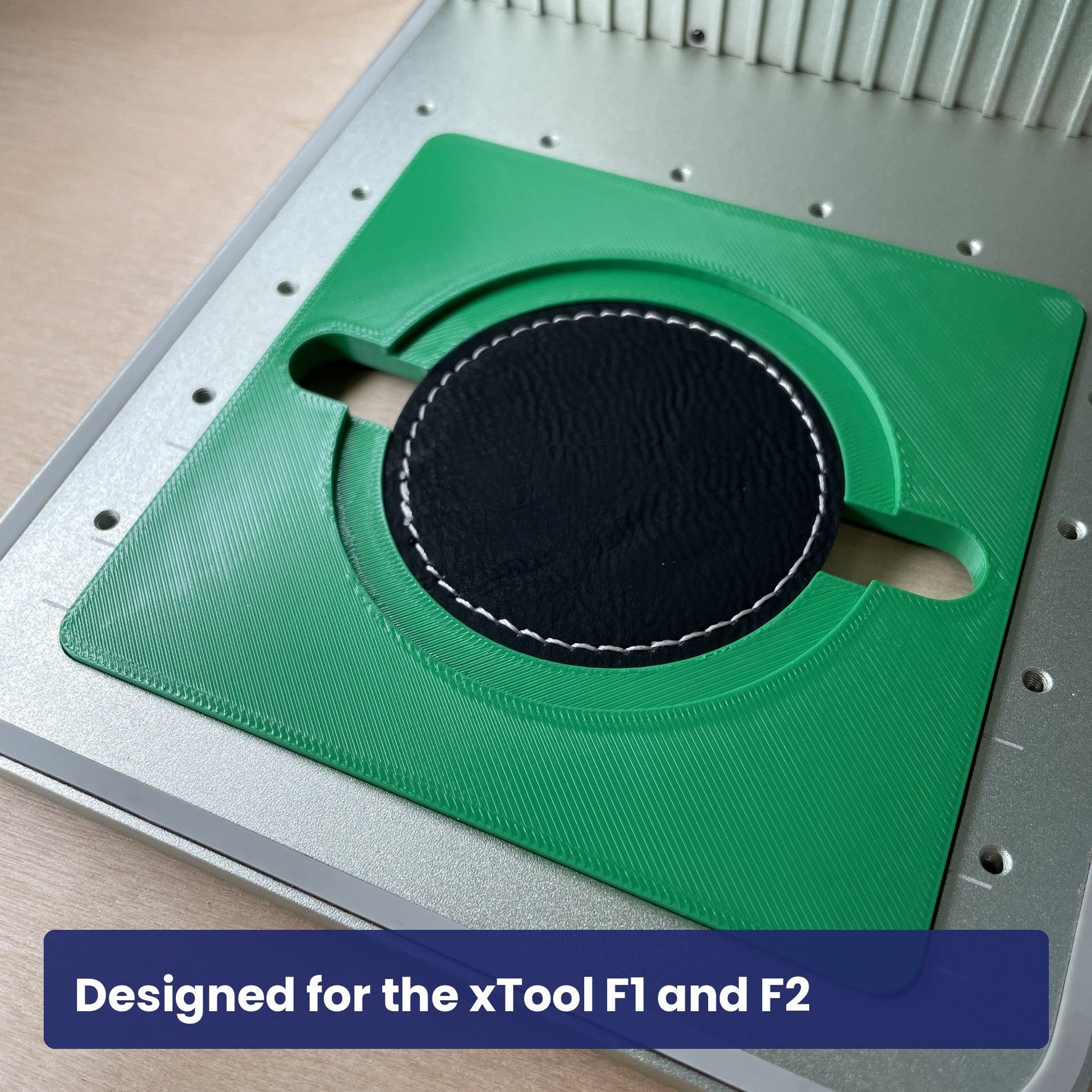 Samcraft round patch jig in the xTool F1 base plate with a smaller round leatherette patch in the recess.