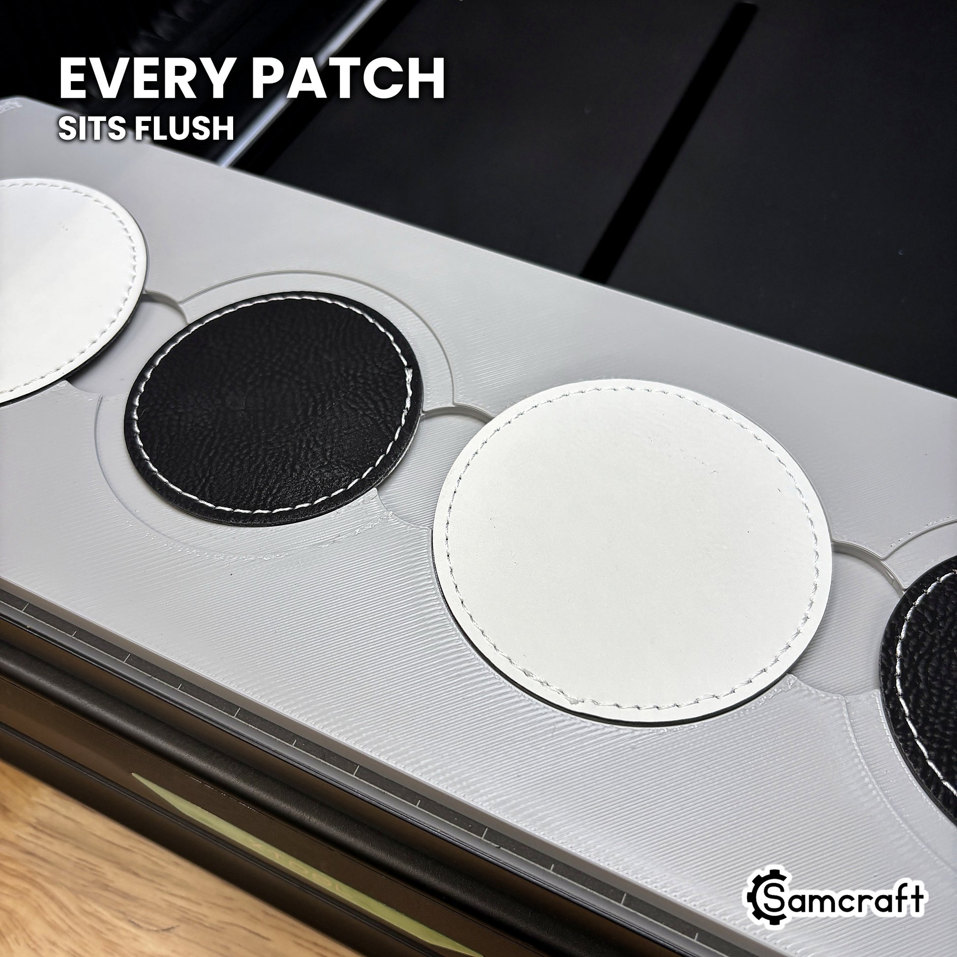 Round leatherette patch seated flush in the Samcraft xTool Omni jig pocket, level with the surrounding surface.
