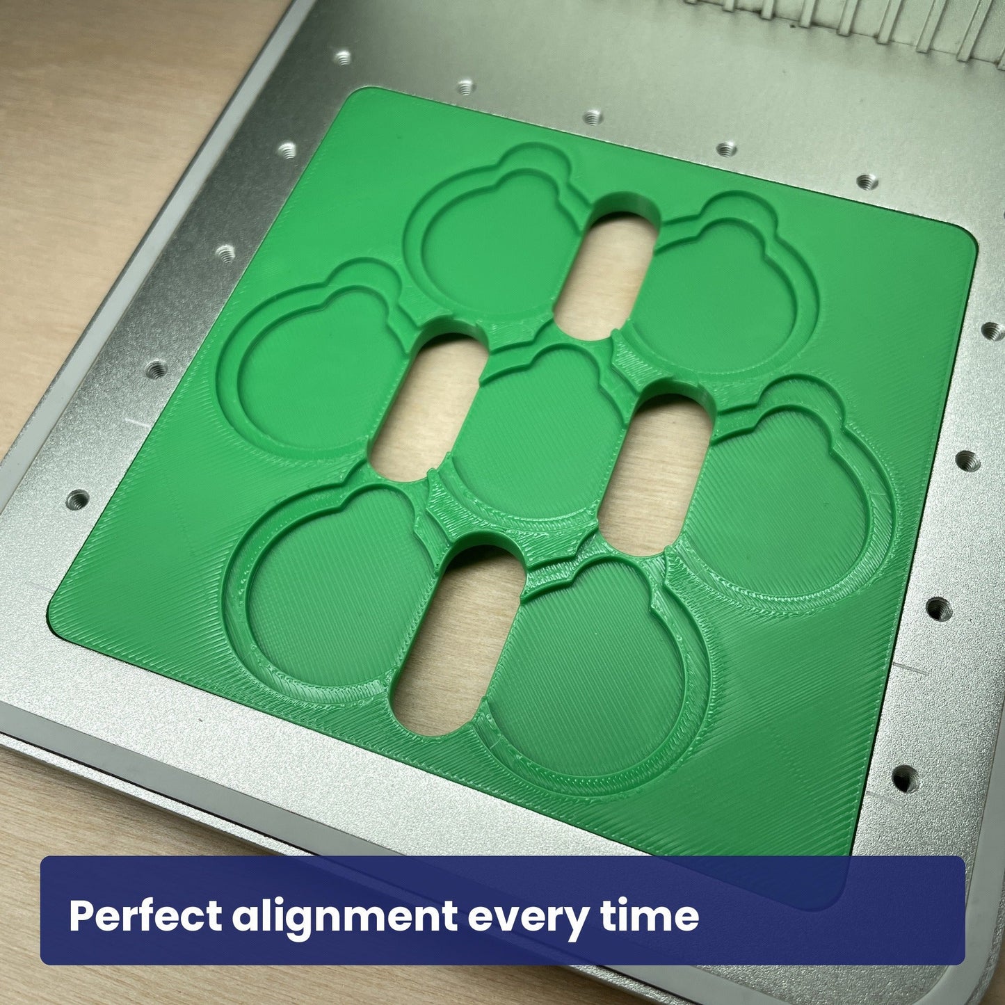 Empty Samcraft round pet tag jig in the xTool F1 bed, showing the circular recesses in both sizes.