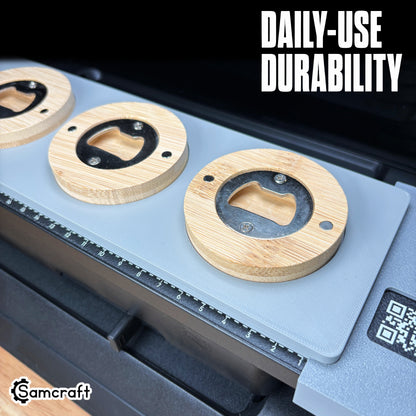 Close-up of round wooden bottle openers seated in the Samcraft jig, showing the metal opener insert and magnets