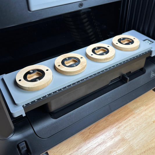 Samcraft Round Wooden Opener Jig holding four round wooden magnetic bottle openers on the eufyMake E1 print bed