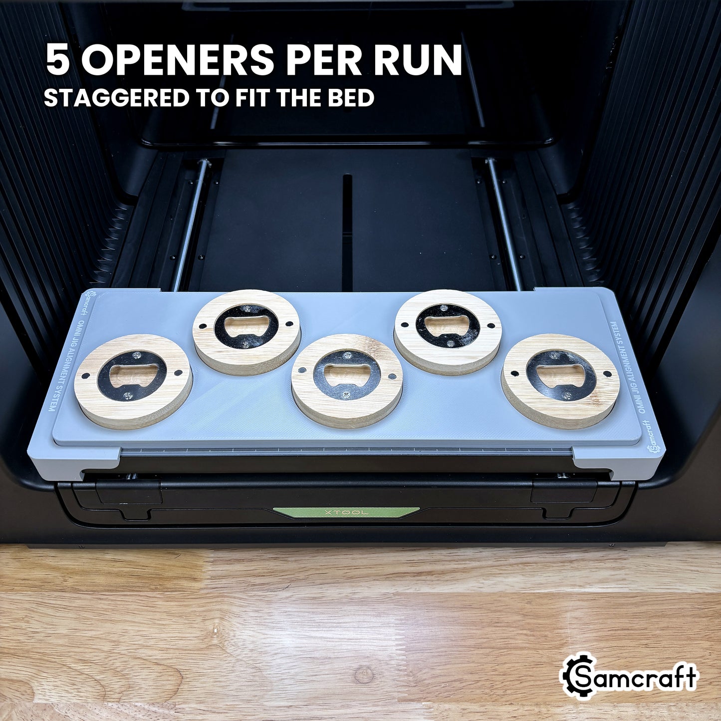 Samcraft round wooden opener jig for the xTool Omni loaded with five openers, staggered to use the full bed width.