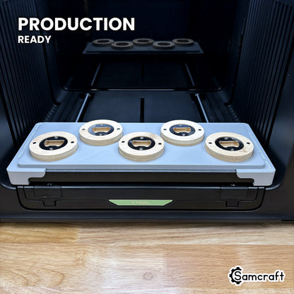 Samcraft round wooden opener jig loaded with five openers on the xTool Omni UV printer bed, set up for production runs.