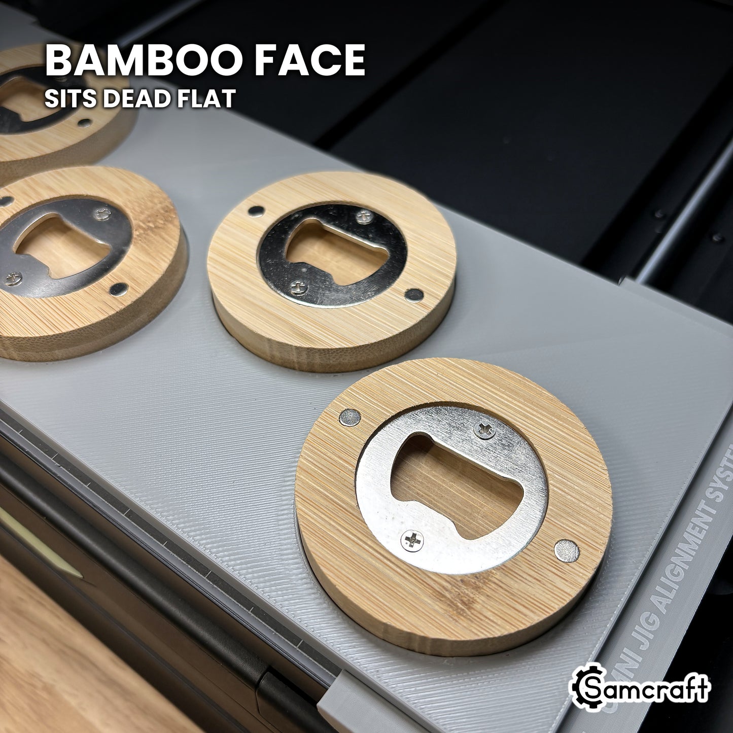 Close-up of a bamboo bottle opener sitting dead flat in the Samcraft xTool Omni jig for an even print across the face.