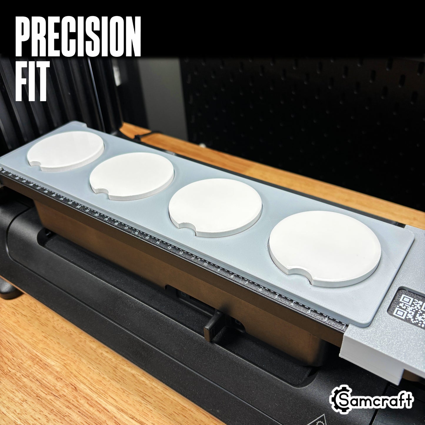 Samcraft car coaster jig viewed from the right, four round coasters seated in a precise fit on a eufyMake UV printer