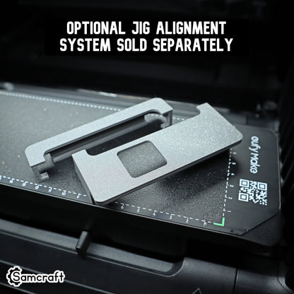 Close-up of Samcraft's optional jig alignment system, two gray 3D-printed alignment pieces sitting on a eufyMake UV printer bed