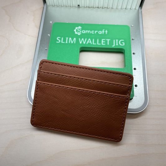 Samcraft slim wallet jig shown with a tan leather card holder resting against it, the wallet size marked on the jig.