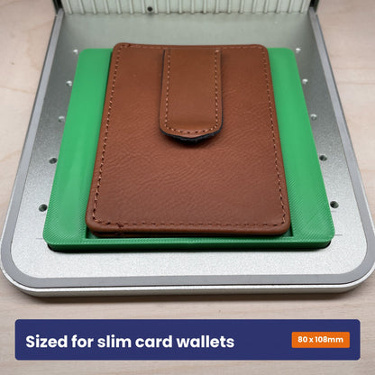 Slim wallet jig holding a brown leather card holder upright in the xTool F1 bed.