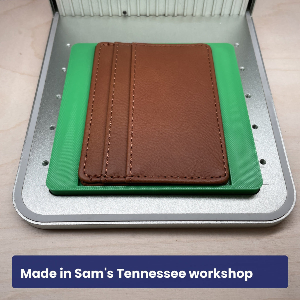 Samcraft slim wallet jig holding a dark brown leather card wallet in the laser bed.