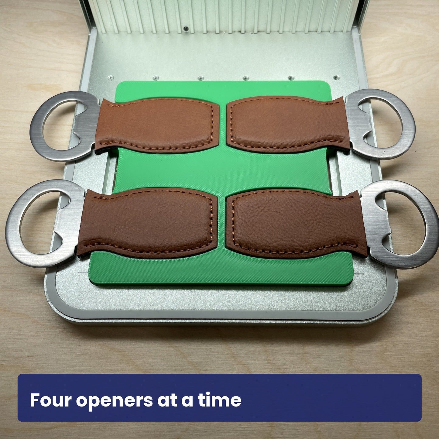 Samcraft small bottle opener jig loaded with four leather-strap bottle openers, showing all four slots in use.