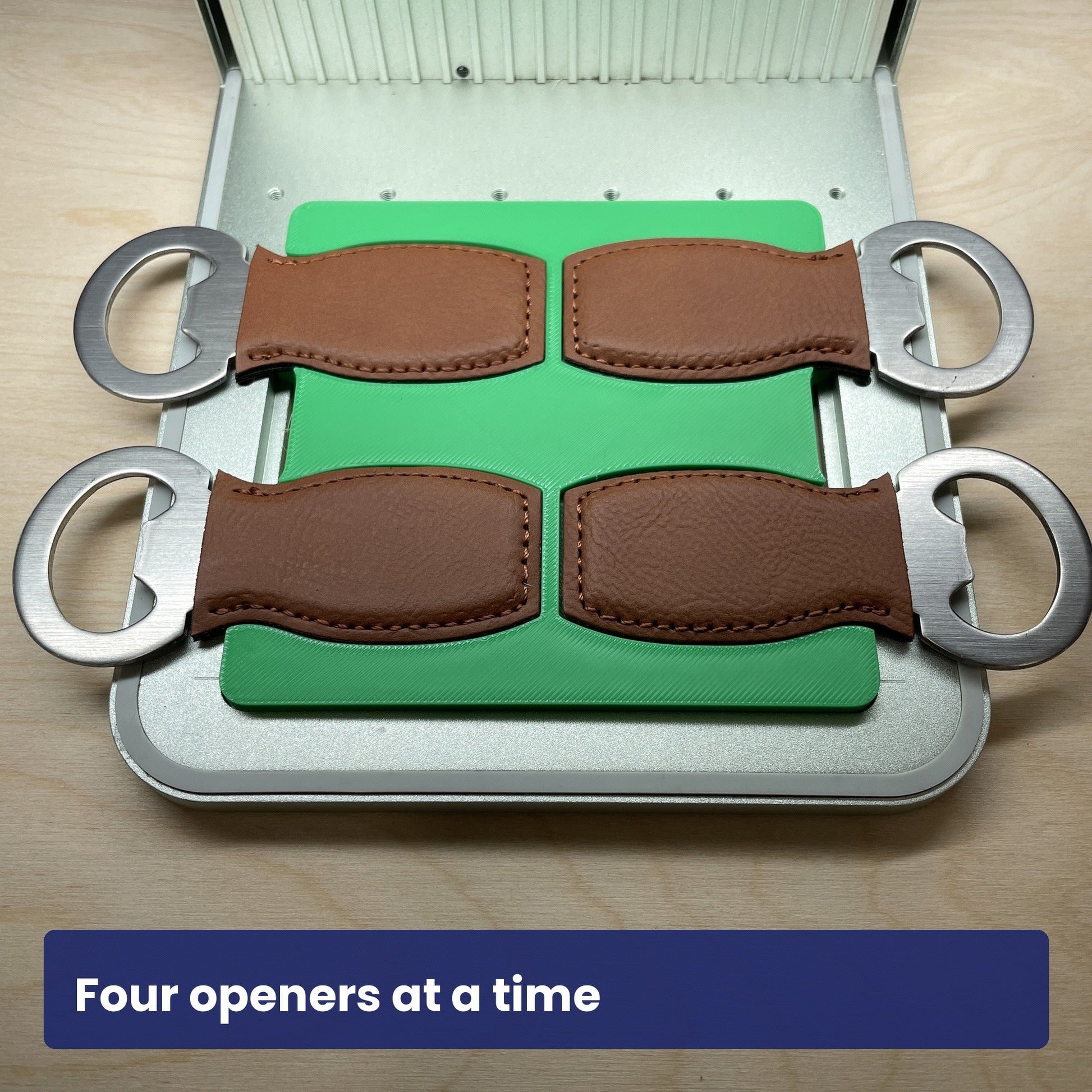 Samcraft small bottle opener jig loaded with four leather-strap bottle openers, showing all four slots in use.