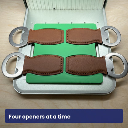 Samcraft small bottle opener jig loaded with four leather-strap bottle openers, showing all four slots in use.