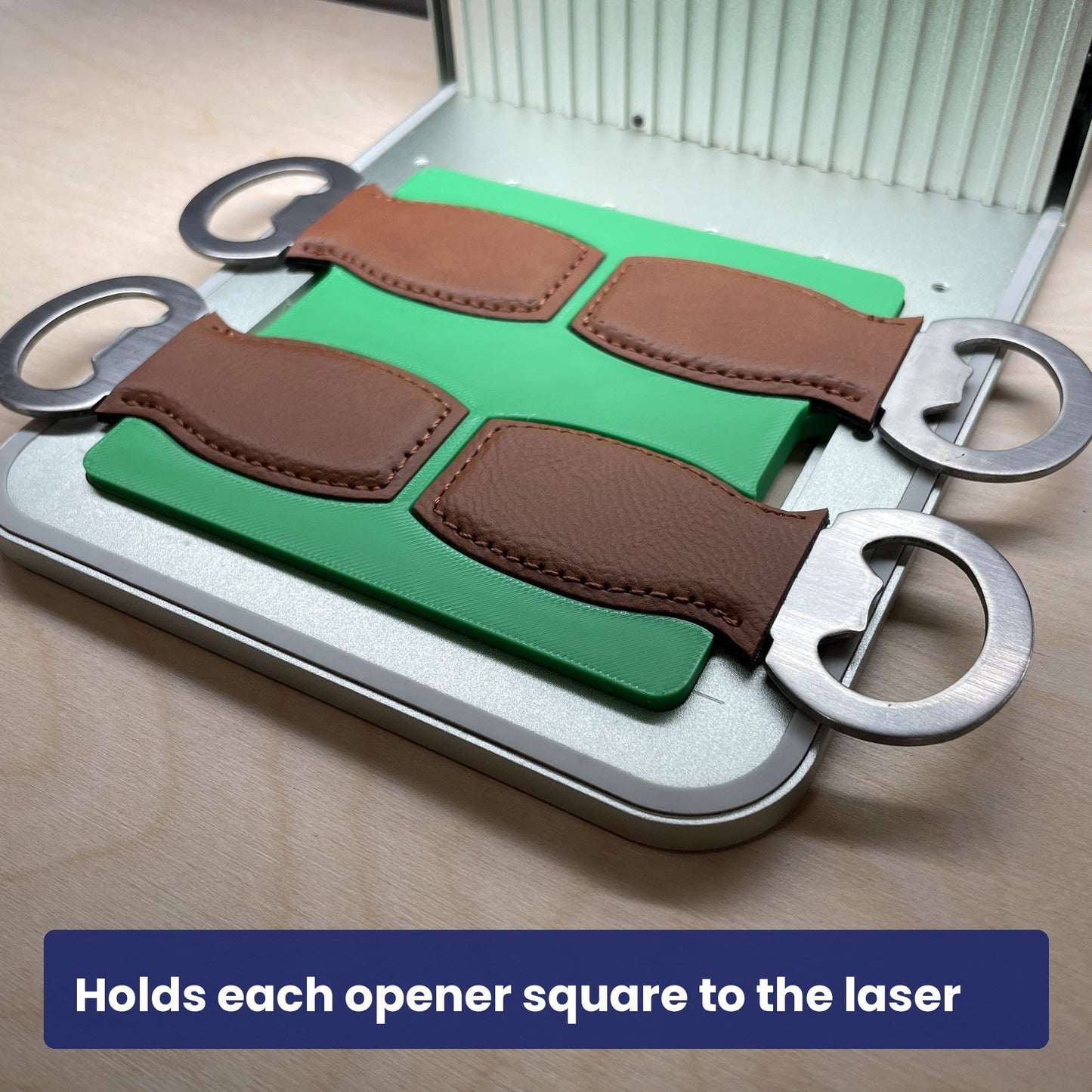 Brown leather bottle openers held square in the Samcraft jig, ready to engrave.