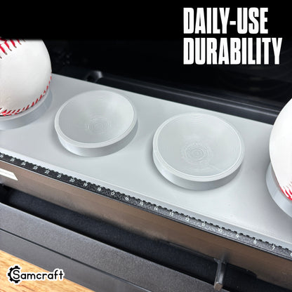 Sports Ball Jig for the eufyMake E1 — close-up of the gray 3D-printed tray with baseballs and empty ring holders on the printer bed with built-in alignment ruler, highlighting daily-use durability.