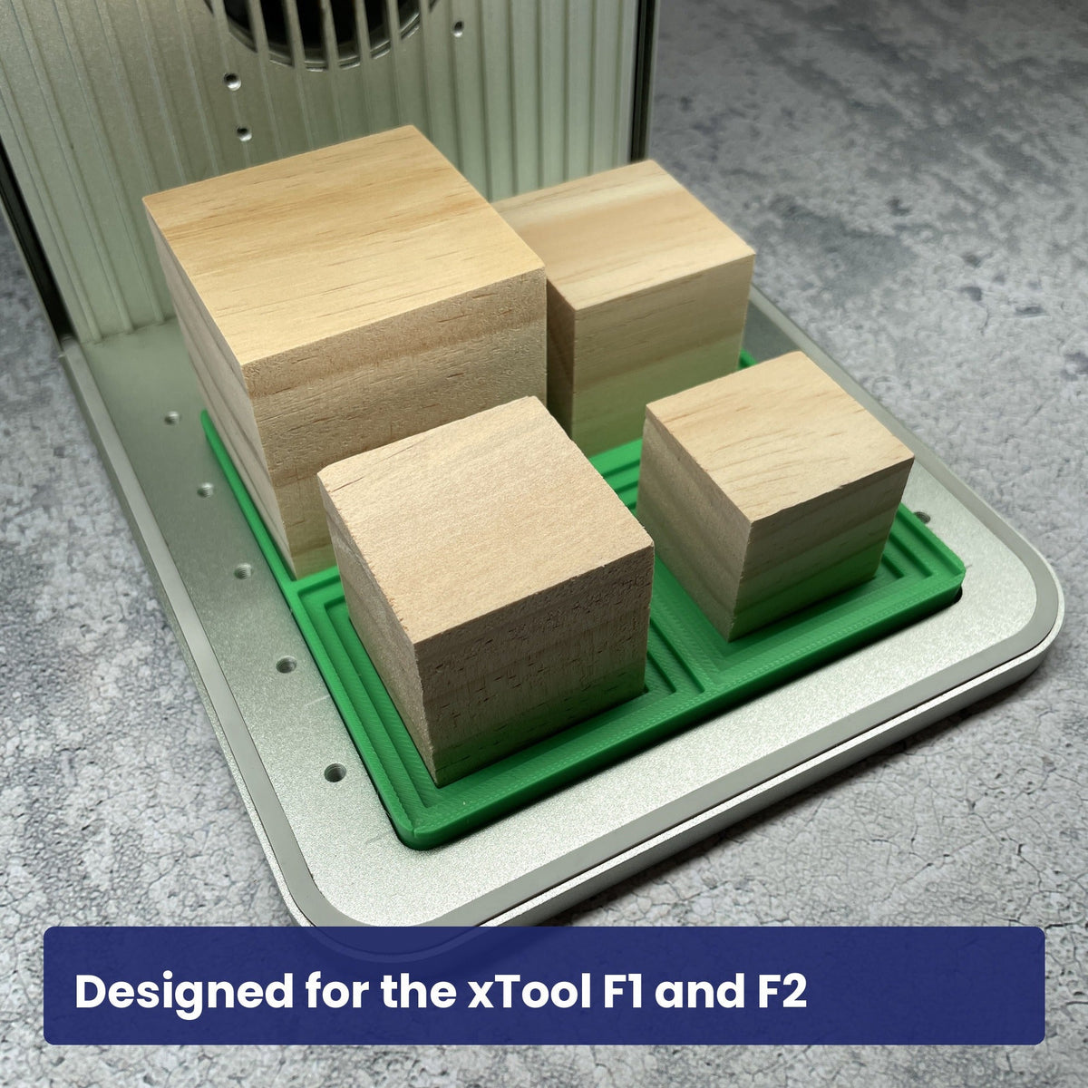 Samcraft square block jig seated in the xTool F1 base plate with wooden blocks in the stepped recesses.