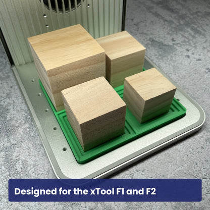Samcraft square block jig seated in the xTool F1 base plate with wooden blocks in the stepped recesses.