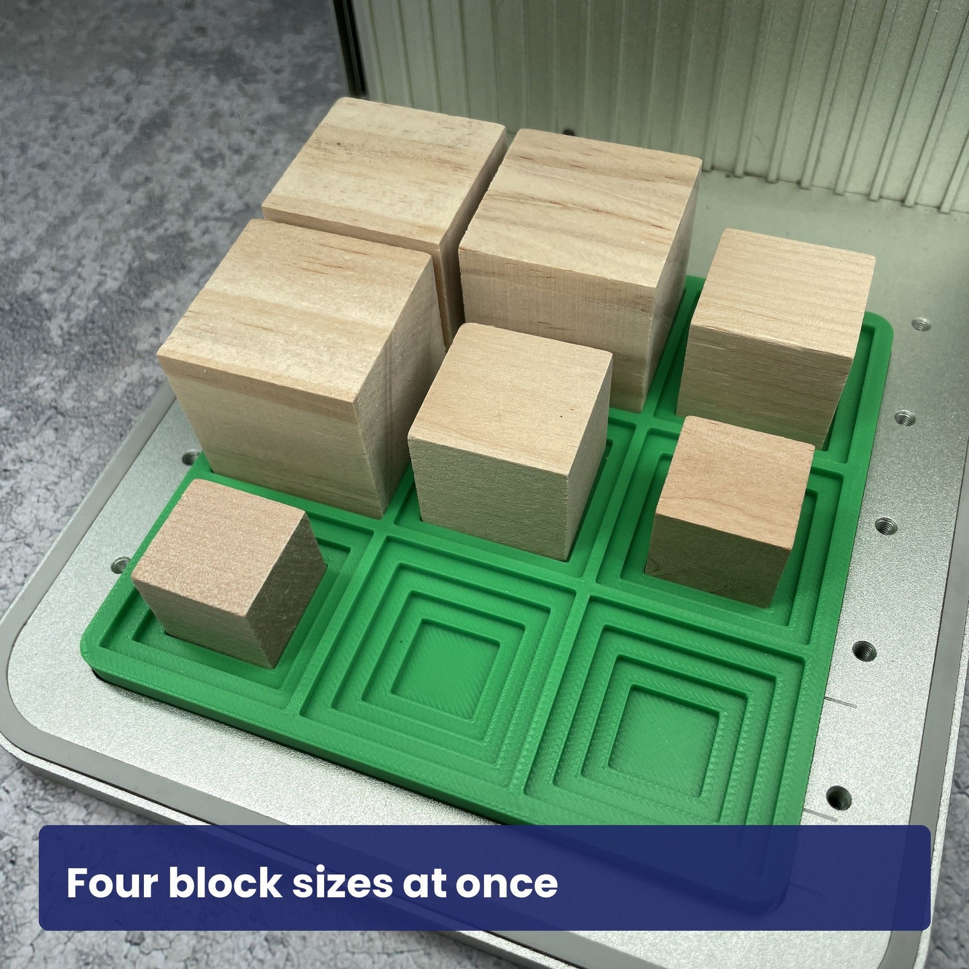 Samcraft small square block jig holding blocks of several sizes at once in the laser bed.