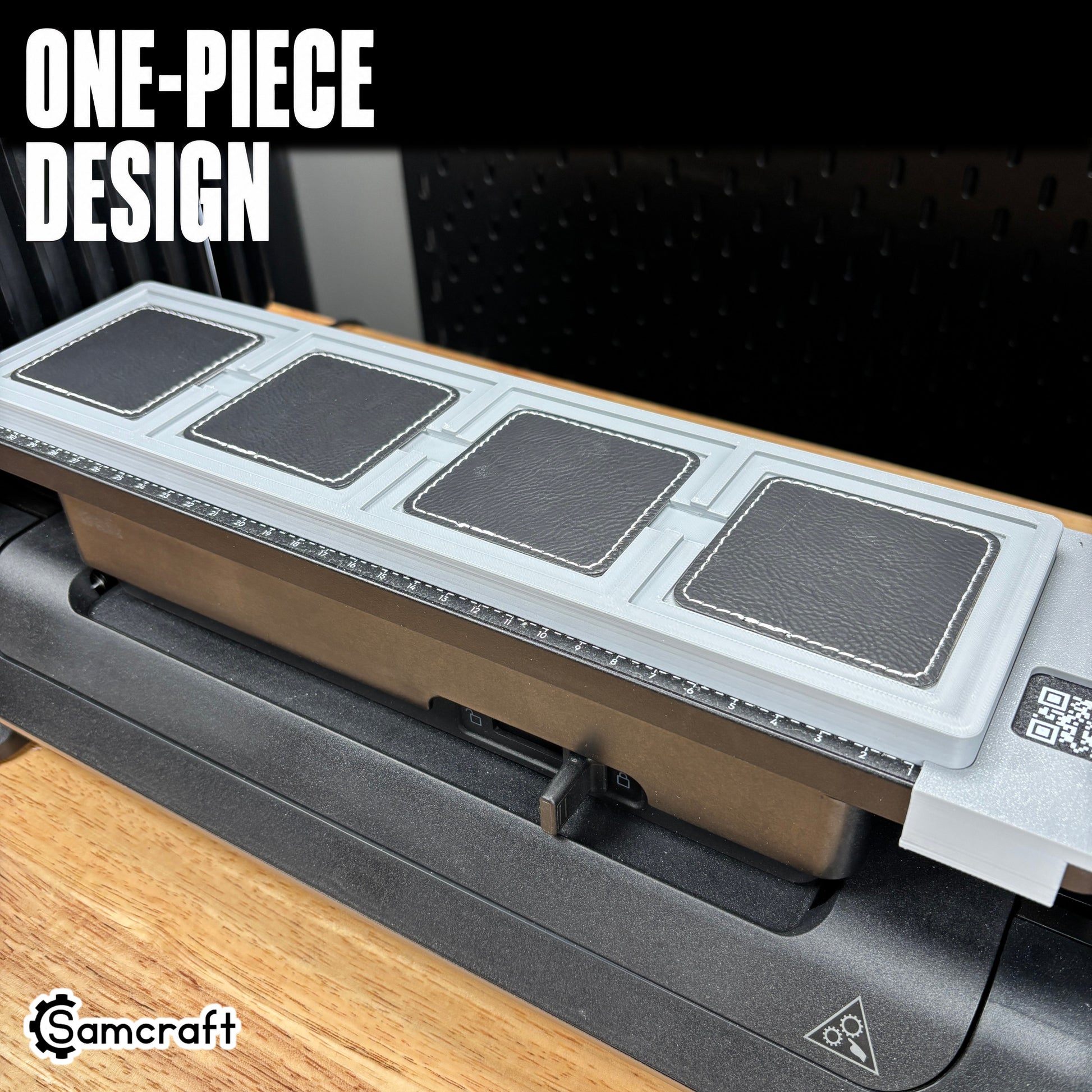 square-patch-jig-eufymake-printer-one-piece-design.jpg

Square Patch Jig for the eufyMake E1 — full view of the gray one-piece 3D-printed tray mounted on the printer, four black leather square patches with white stitched borders in their molded pockets, with the built-in measurement ruler, showing the solid single-piece design.