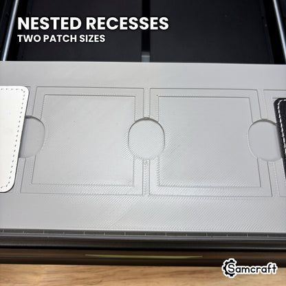 Close-up of the nested recesses in the Samcraft xTool Omni square patch jig, the larger patch in the outer step and the smaller one in the inner.