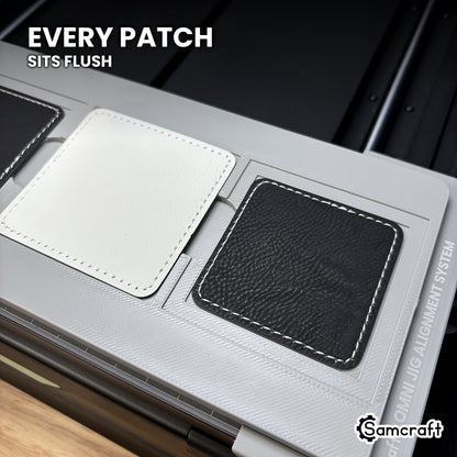 Square leatherette patch seated flush in the Samcraft xTool Omni jig pocket, level with the surrounding surface.