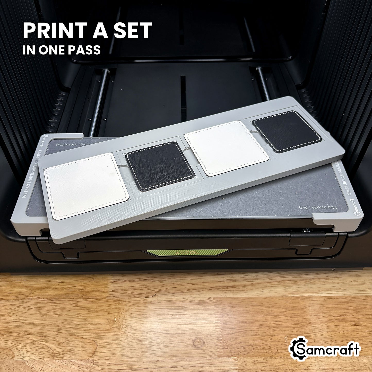 Four printed square leatherette patches in the Samcraft xTool Omni jig, a matching set finished in a single job.