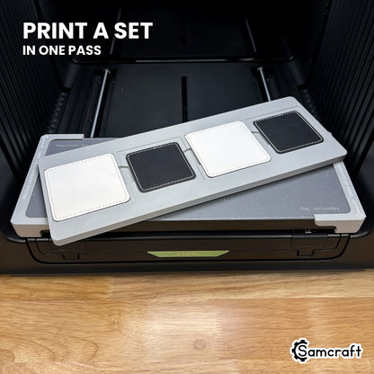 Four printed square leatherette patches in the Samcraft xTool Omni jig, a matching set finished in a single job.