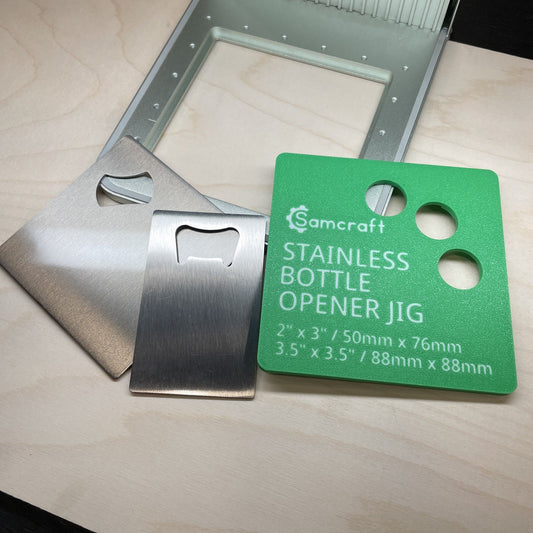 Samcraft stainless bottle opener jig in an xTool F1 laser bed holding a stainless steel bottle opener.
