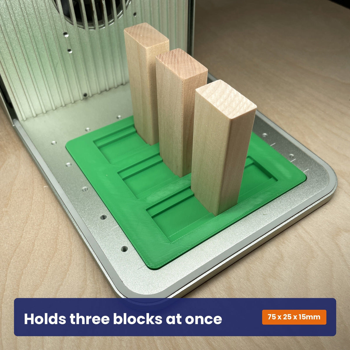 Tumbling tower jig holding wooden blocks stood upright, showing blocks can be engraved in any orientation.