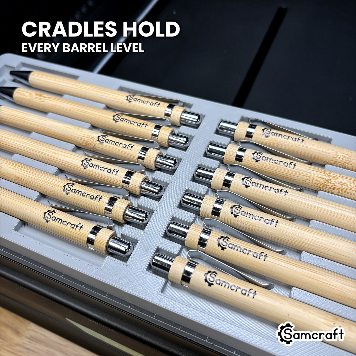 Curved cradles in the Samcraft xTool Omni pen jig holding every pen barrel at the same height for consistent print depth.